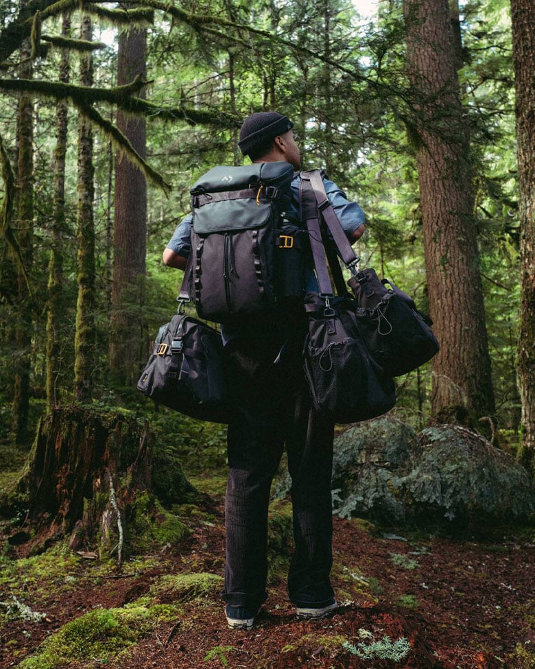 man with carrying bags in outdoors.