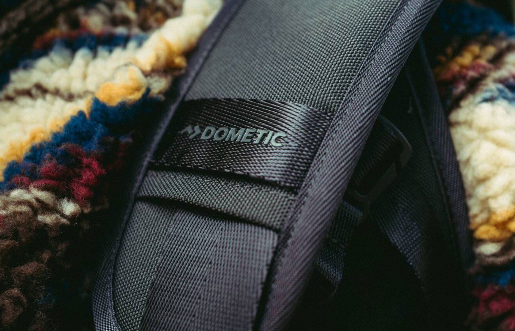 shoulder strap of bag.