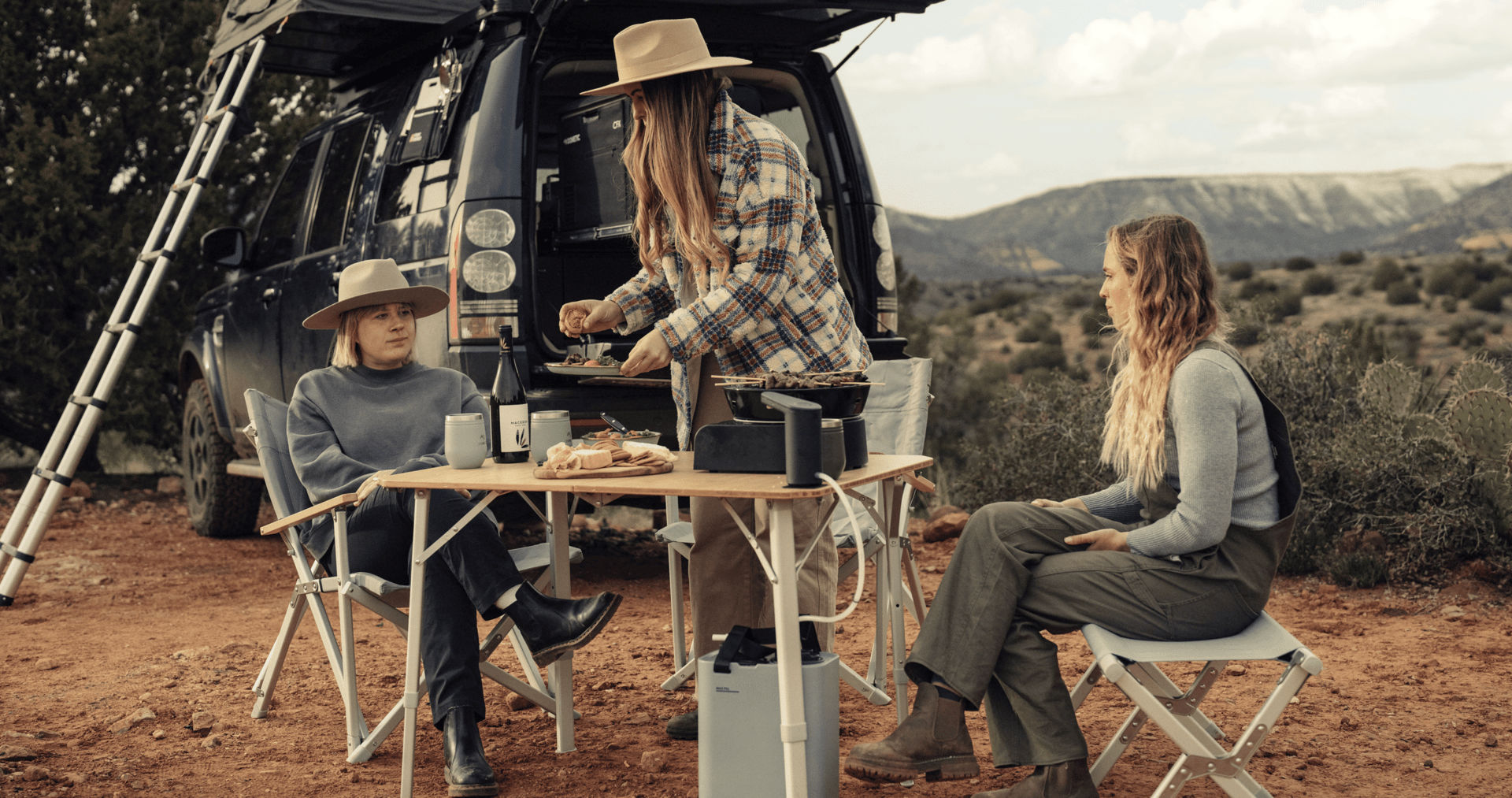 Sarah Glover and friends eating at camp using Dometic gear