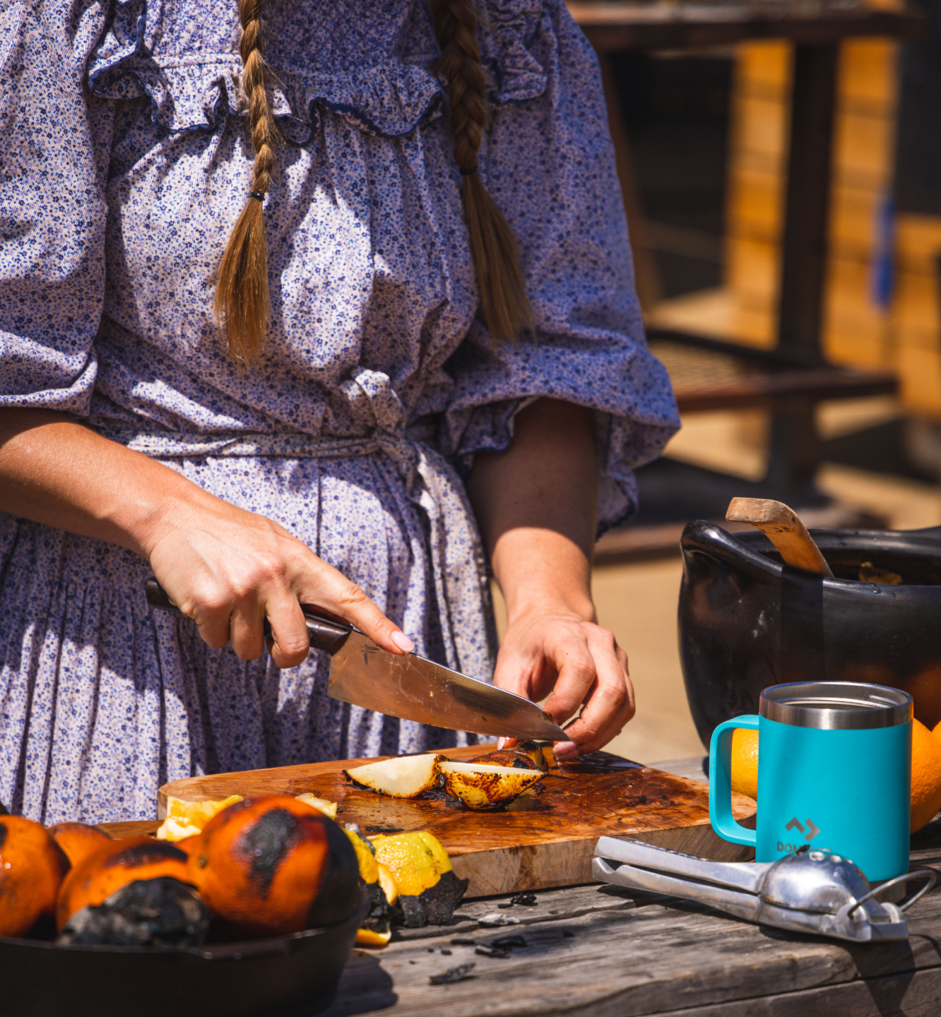 Sarah Glover cutting fruit for smoky sangria