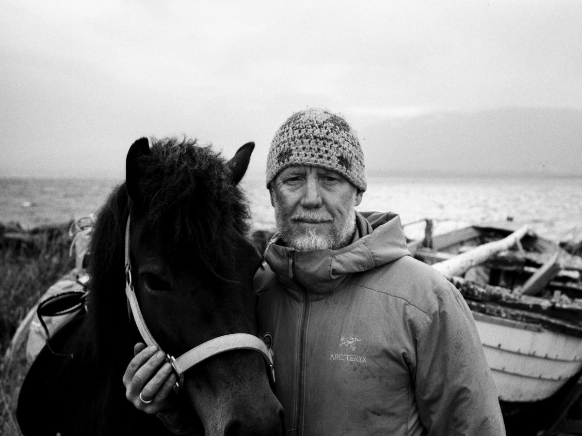 Adventurer Geoff Wilson with a horse