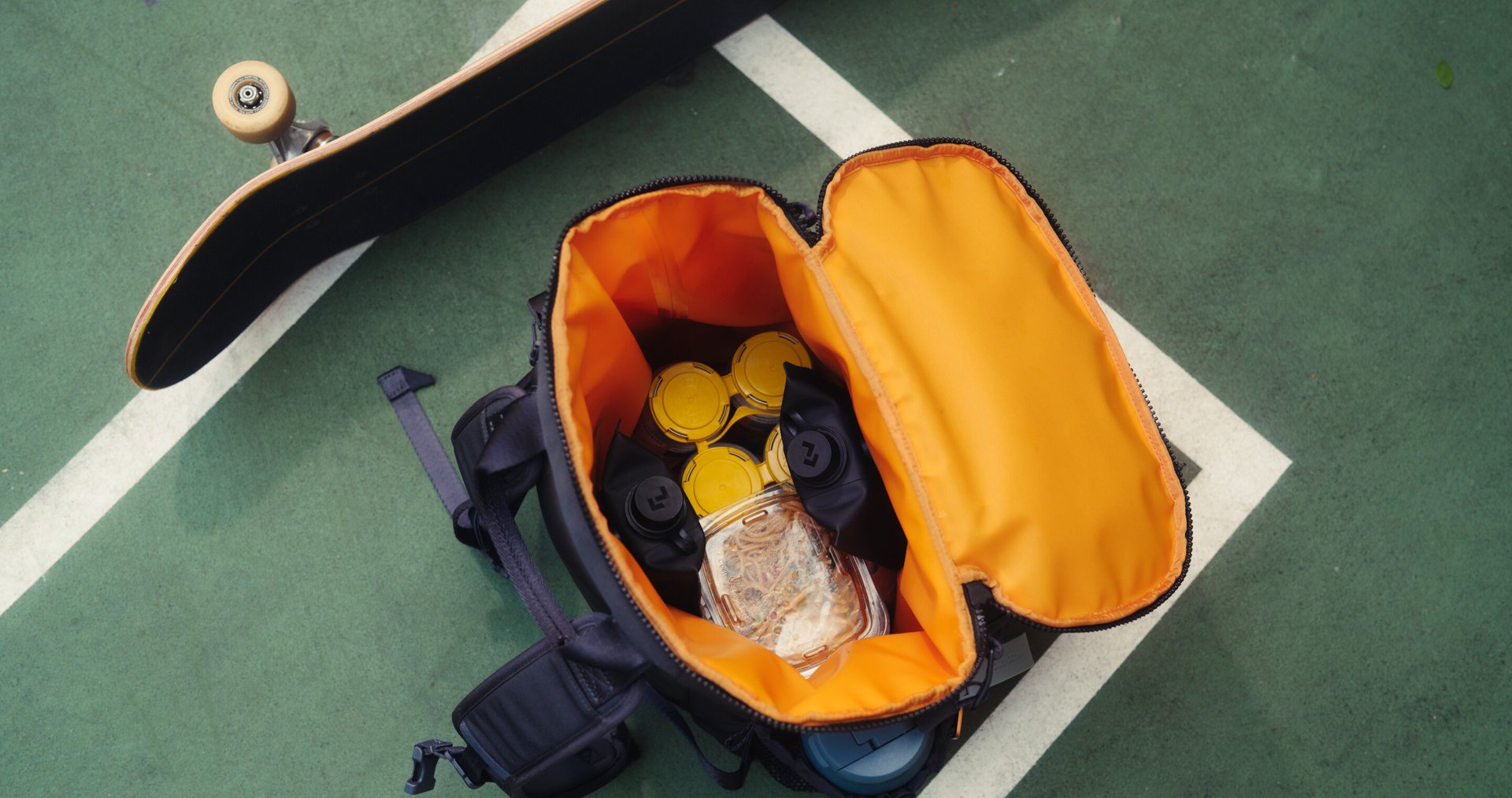 reaching into a backpack.