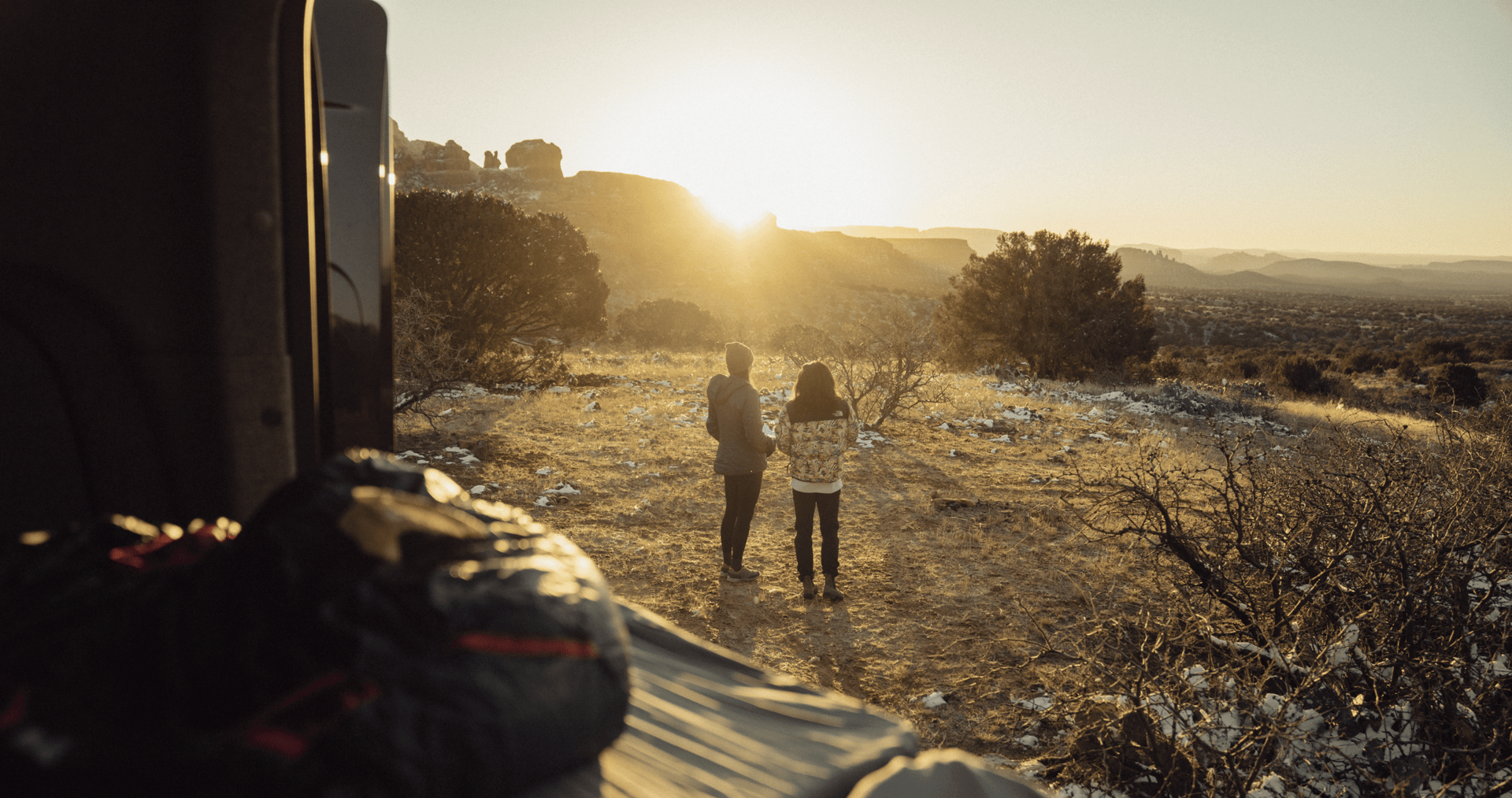 Two women watching sunrise