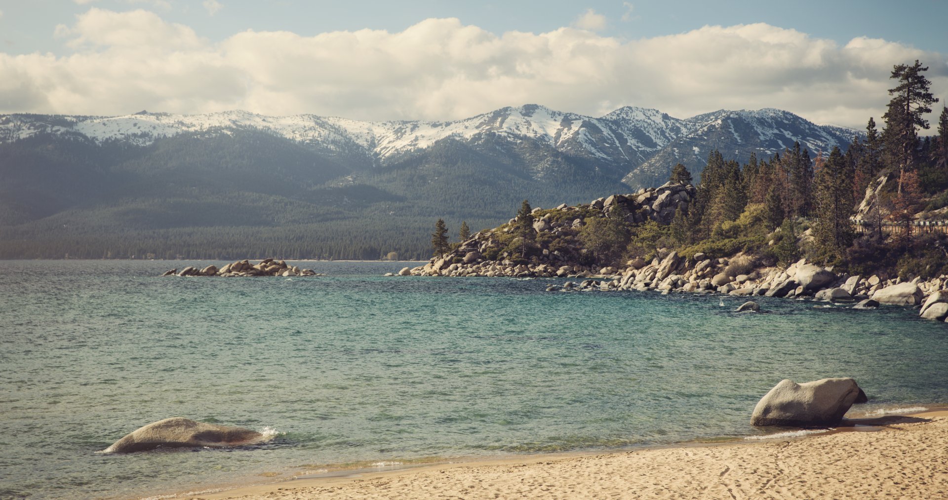 Pebble beach with mountains in the distance
