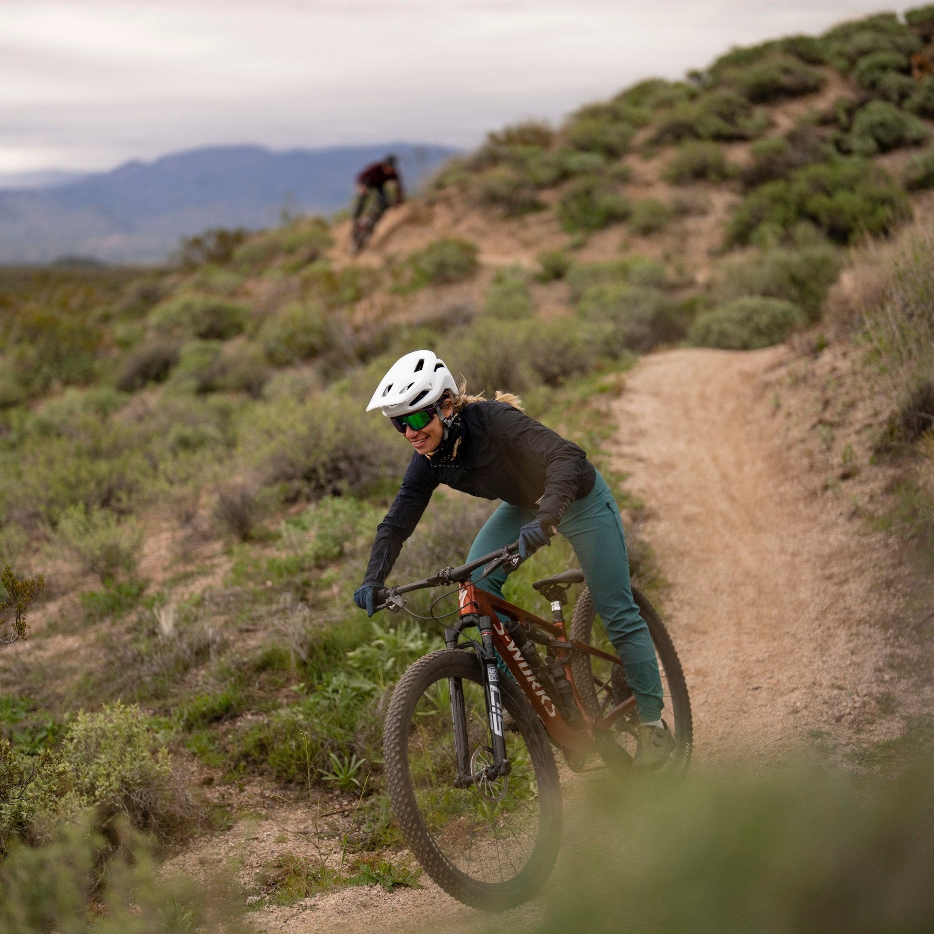 Female mountain biker on trail