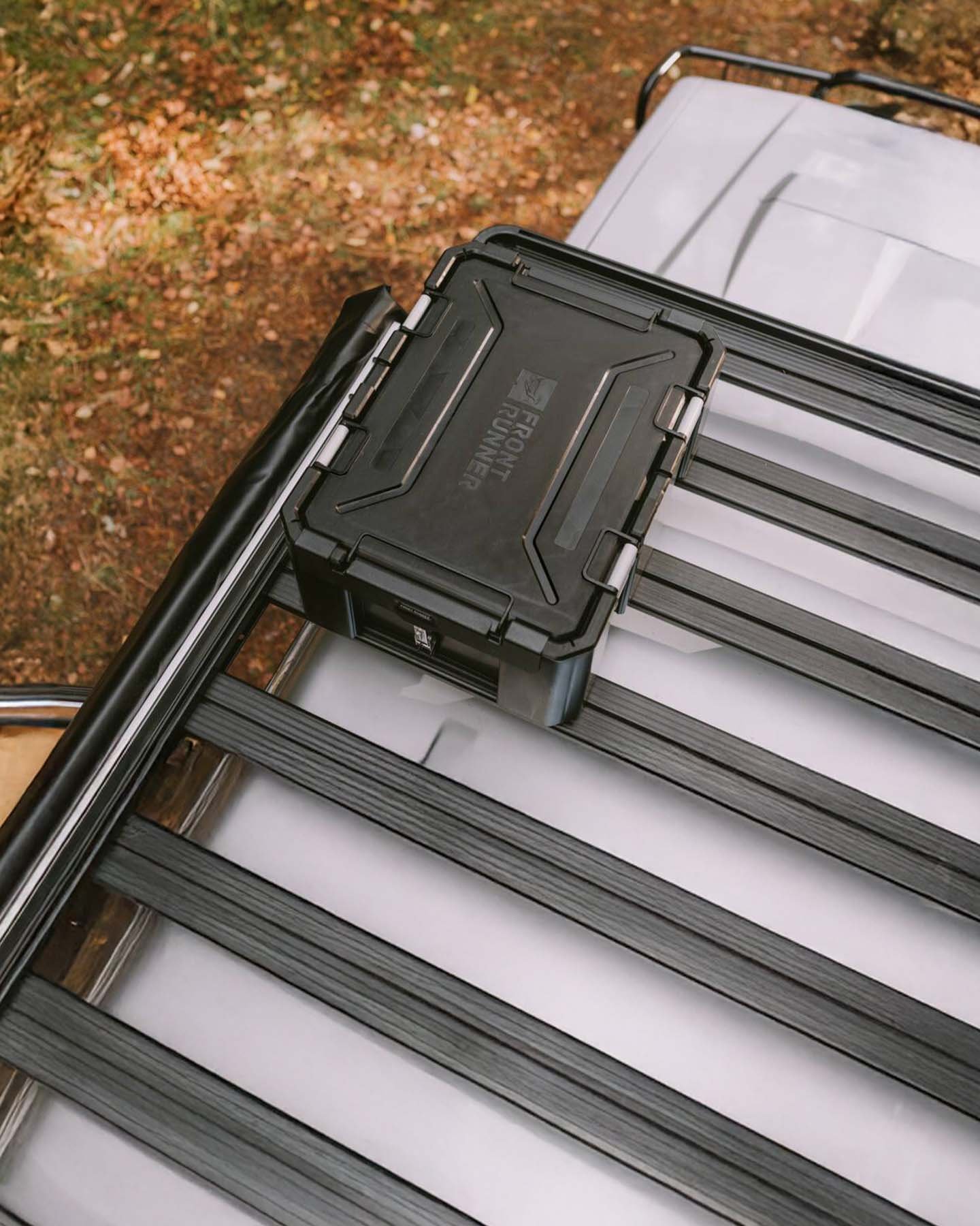 Front Runner Dometic Slimline II roof rack viewed from above with Wolf Pack Pro storage box mounted using bracket