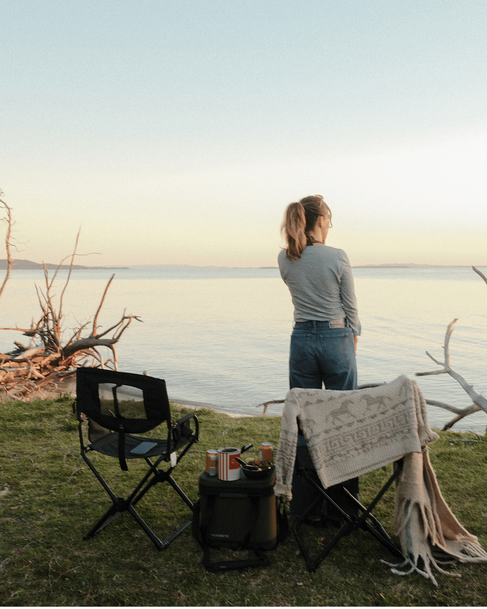 Breanne soaks up the spectacular waterfront sunset from her camp on North Stradbroke Island.