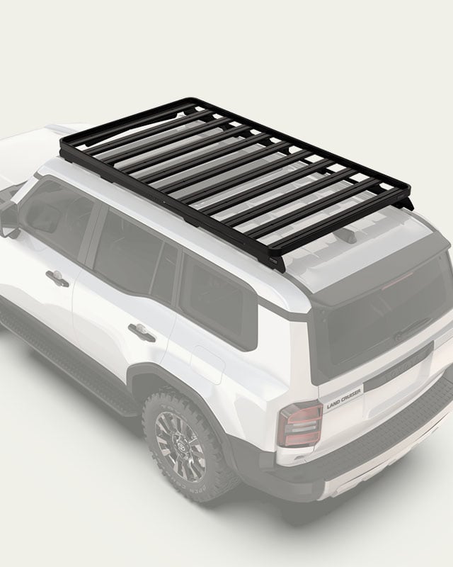 Slimline II roof rack mounted on a Toyota Land Cruiser, modular roof rack platform with full-perimeter side rails in a vehicle-specific configuration