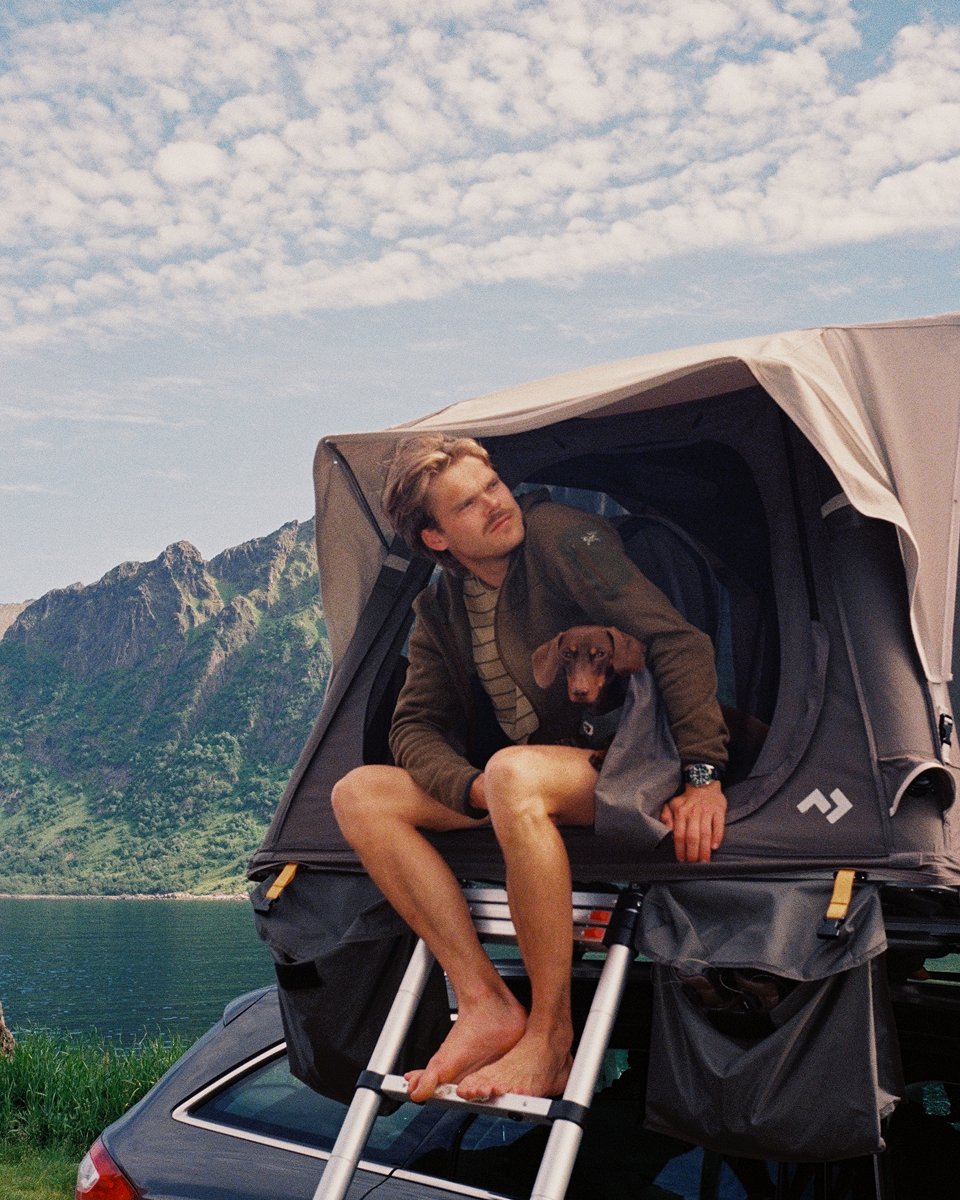 Therese Elgquist with boyfriend and dog camping ina rooftop tent
