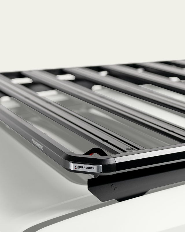 Dometic Front Runner Series Slimline 3 roof rack platform mounted on a white SUV for overland cargo storage and outdoor adventures