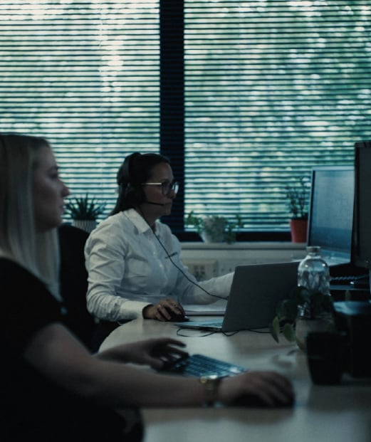 Two people working in an office