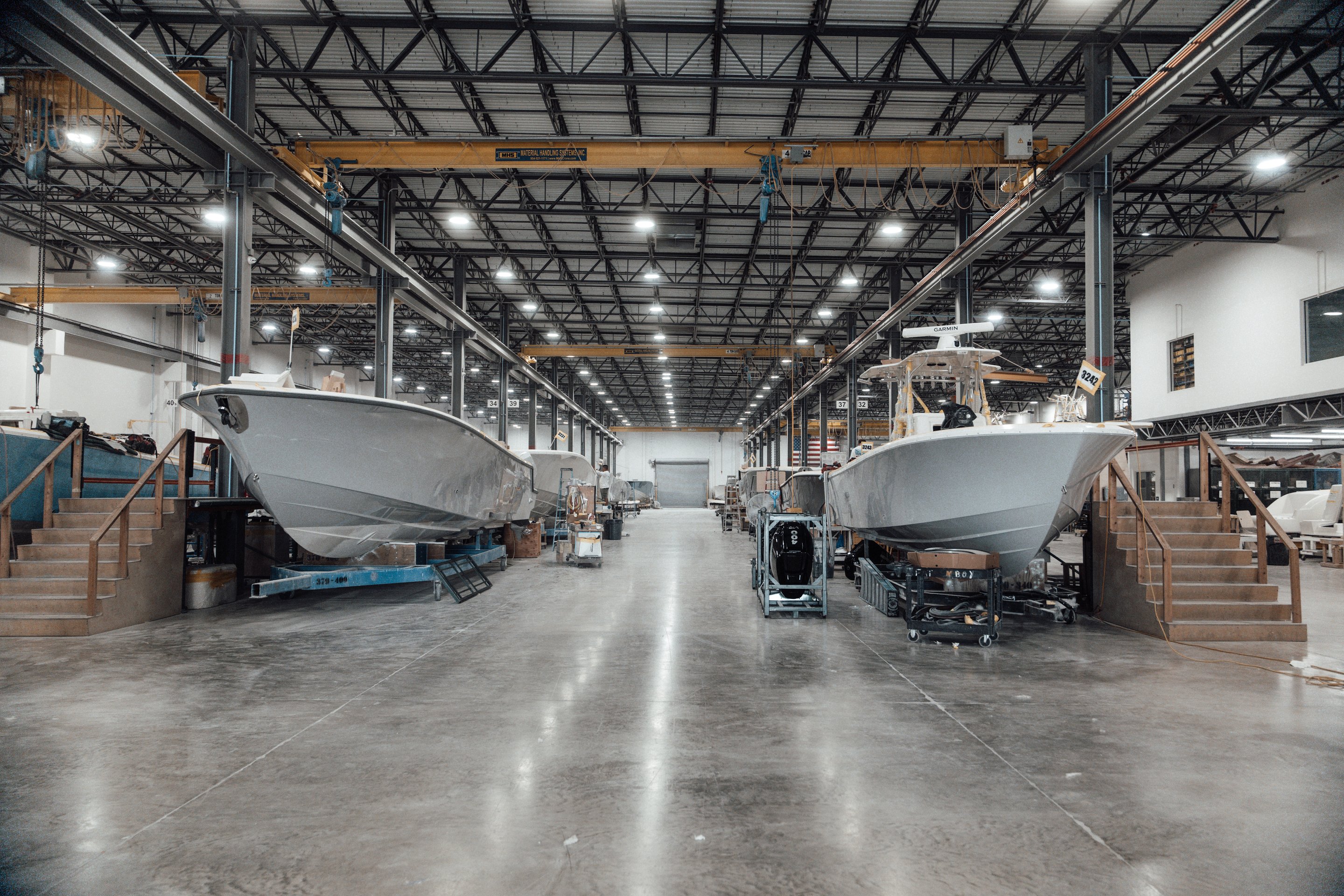 Boats displayed on factory floor
