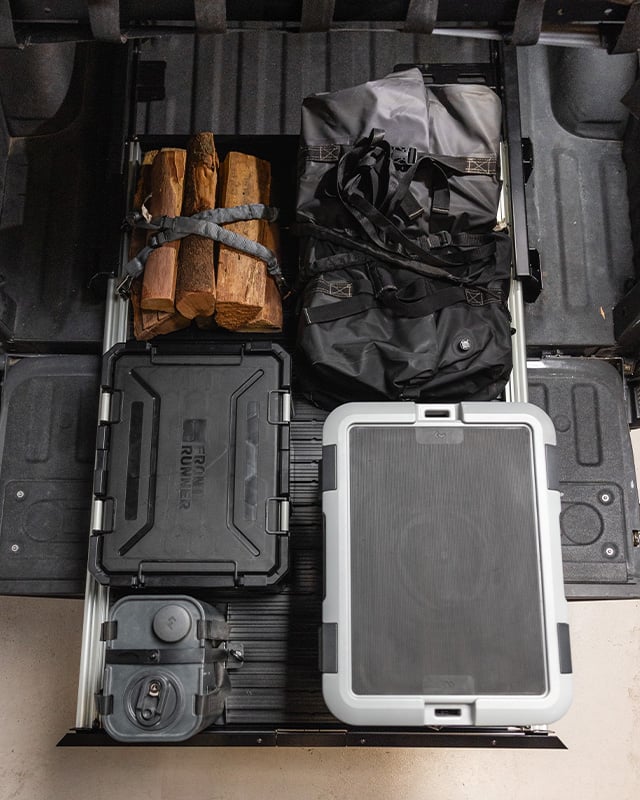 Top view of cargo bed slide with storage and gear.
