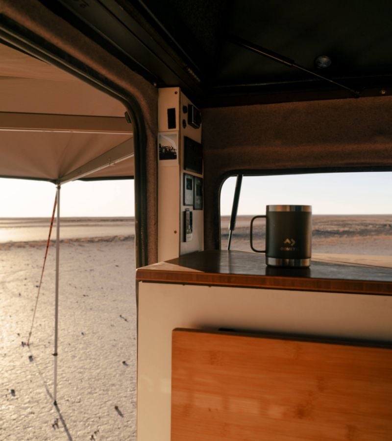 Dometic Mug on a shelf inside a van