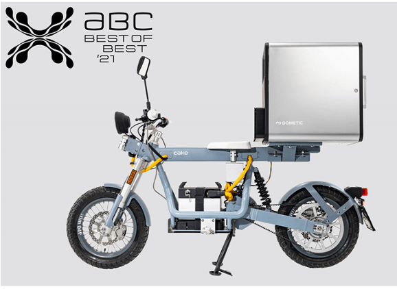 A studio photo of a blue bike with a Dometic Delibox on the back.