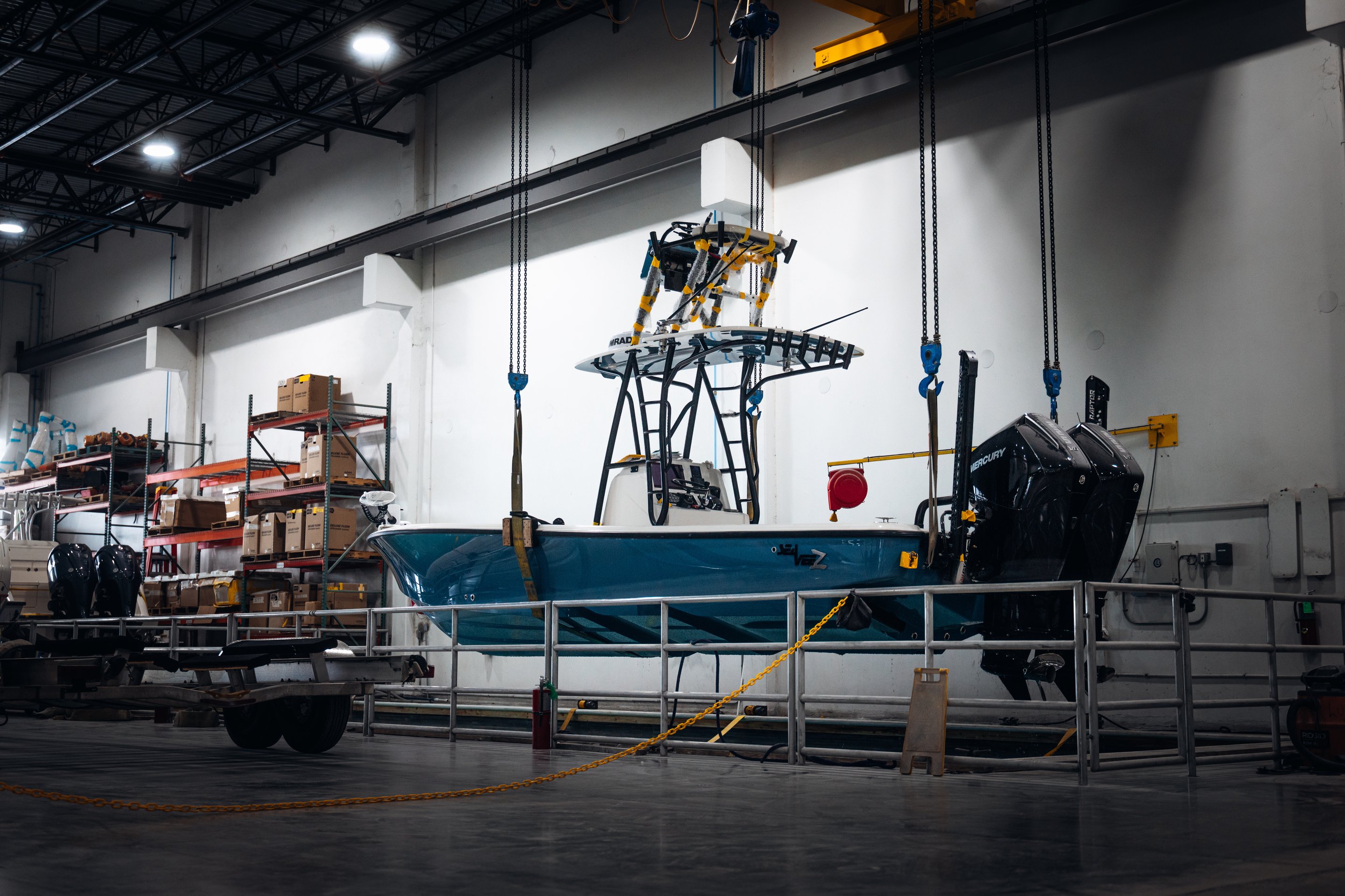 Boat under construction on factory floor