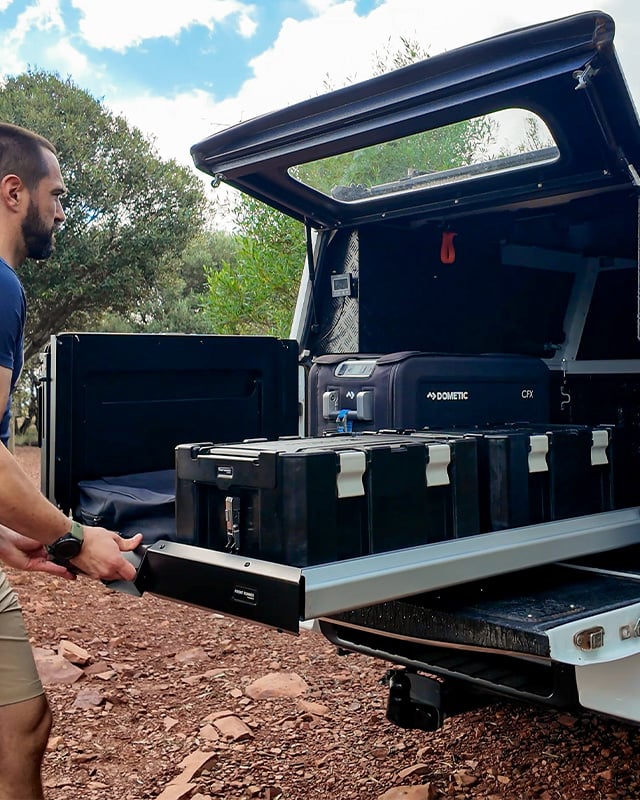 Cargo bed slide with wolf packs and a fridge