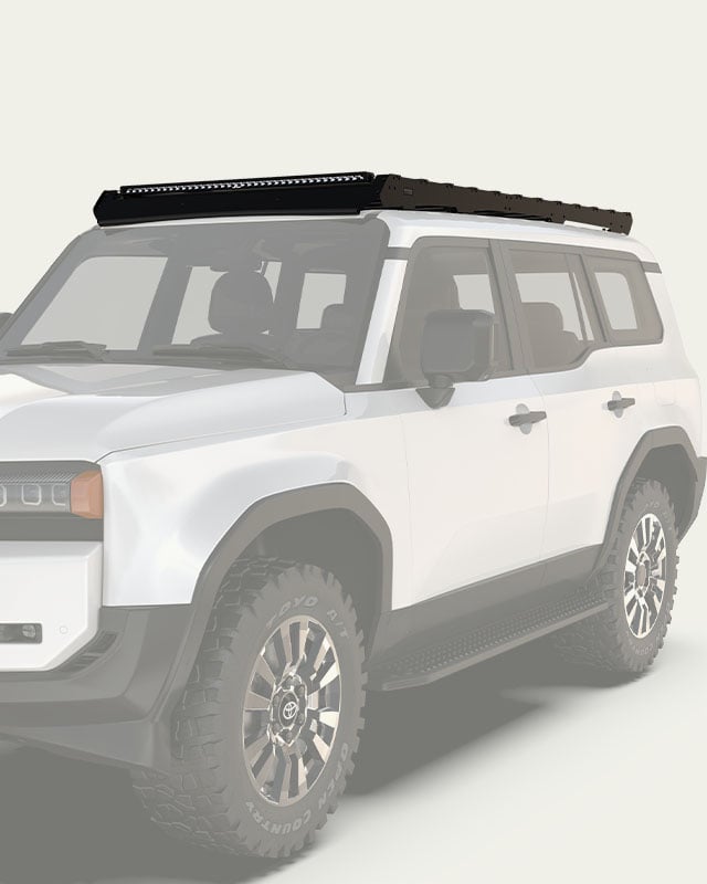 Slimsport roof rack mounted on a Toyota Land Cruiser, low-profile roof rack with slats shown in vehicle-specific configuration