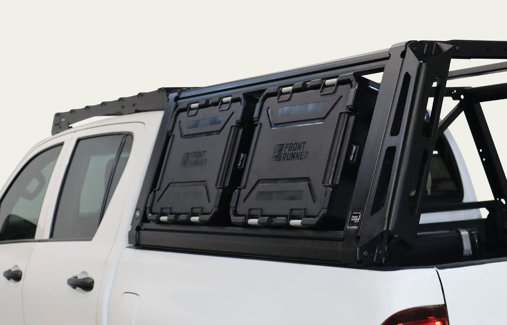 Pro Bed Rack System mounted on a pickup truck with side-mounted Wolf Pack Pro storage boxes, providing secure and accessible gear storage