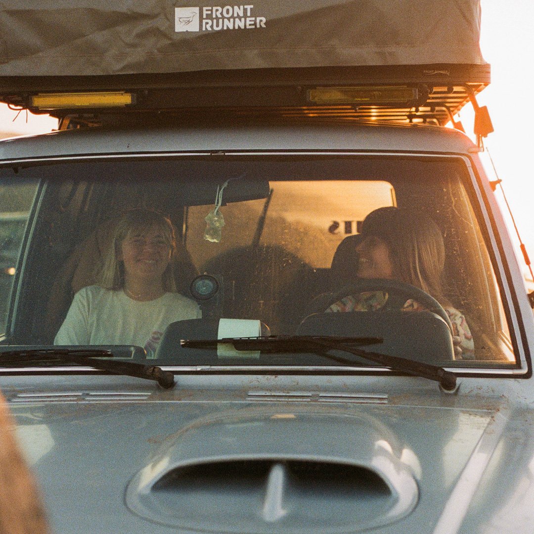 1:1 Women in Car Front Runner Rooftop Tent Sundown