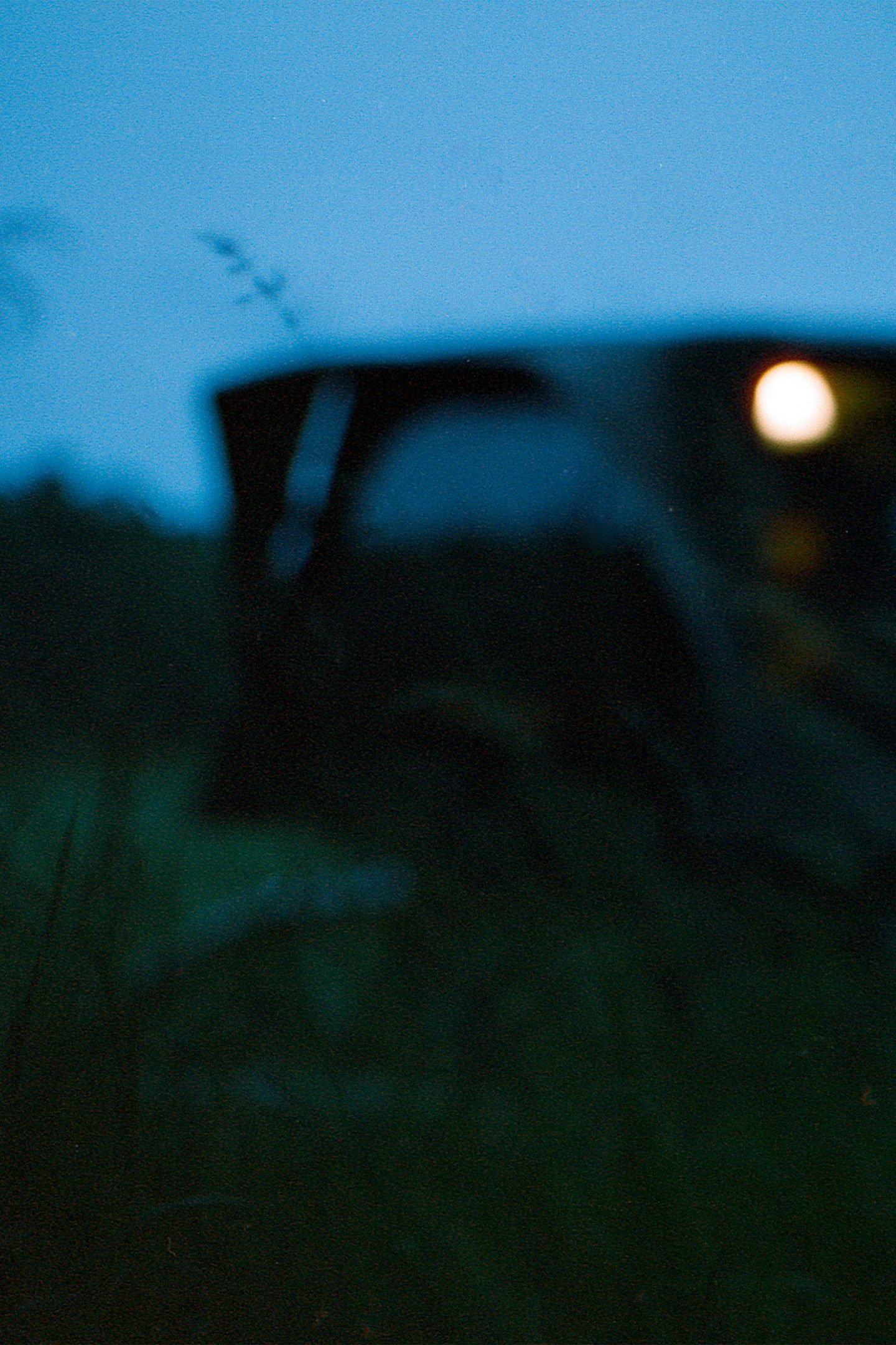 Standing - Tim Latte - Blurry Roof top tent at night TRT RTT rooftop