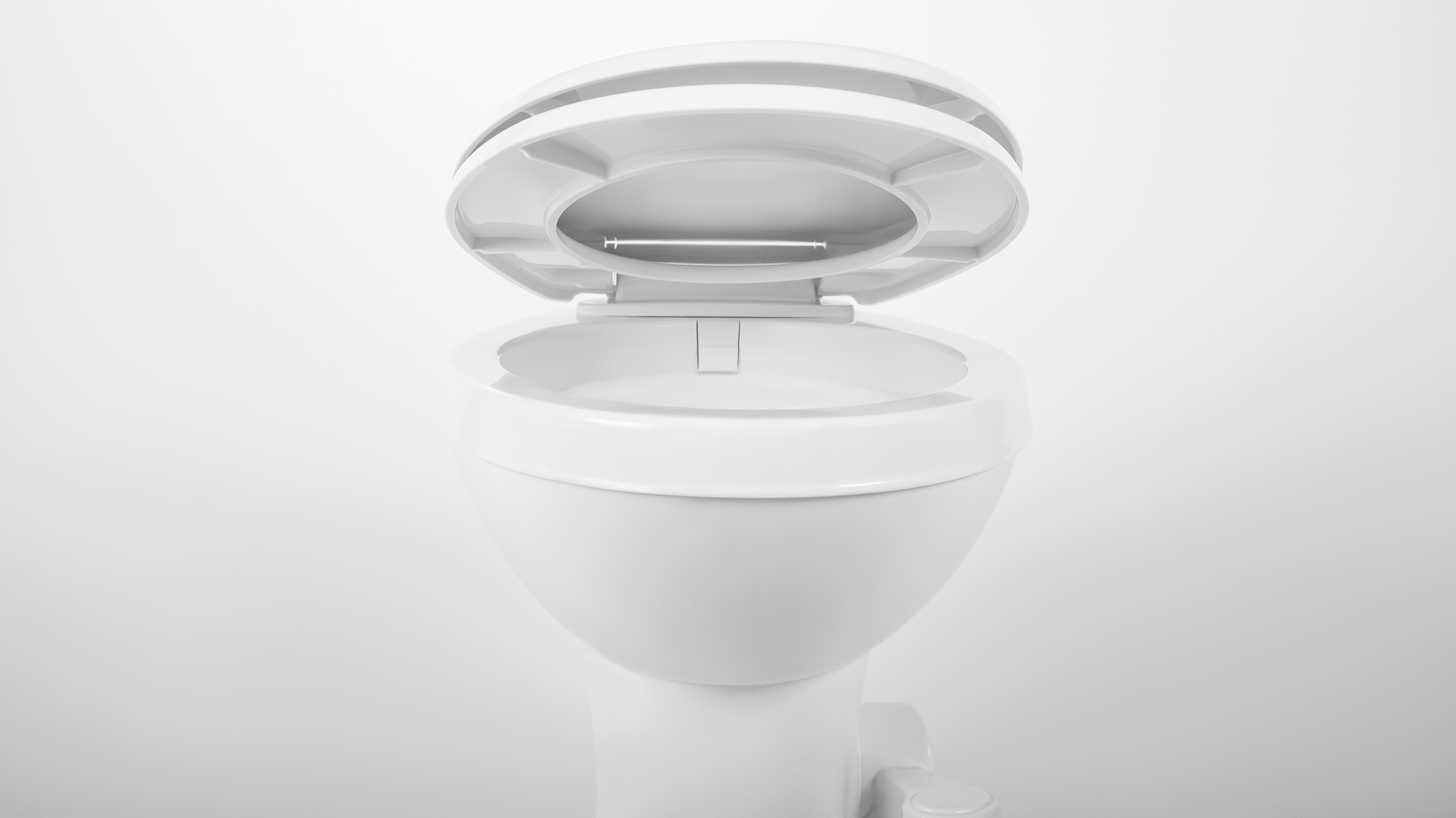 400 Series RV white toilet bowl with lid open.