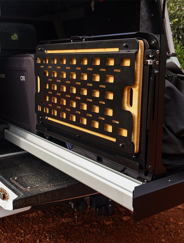 Drop down table made for cargo bed slide on a bakkie with molle panels