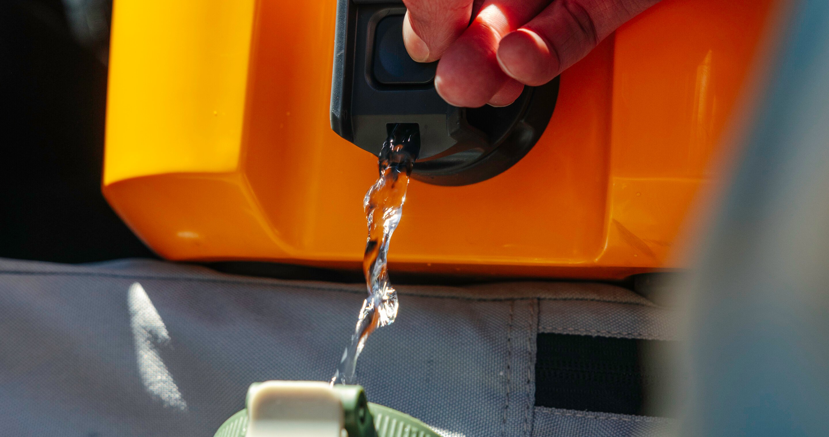 Water pouring out of cooler spout.