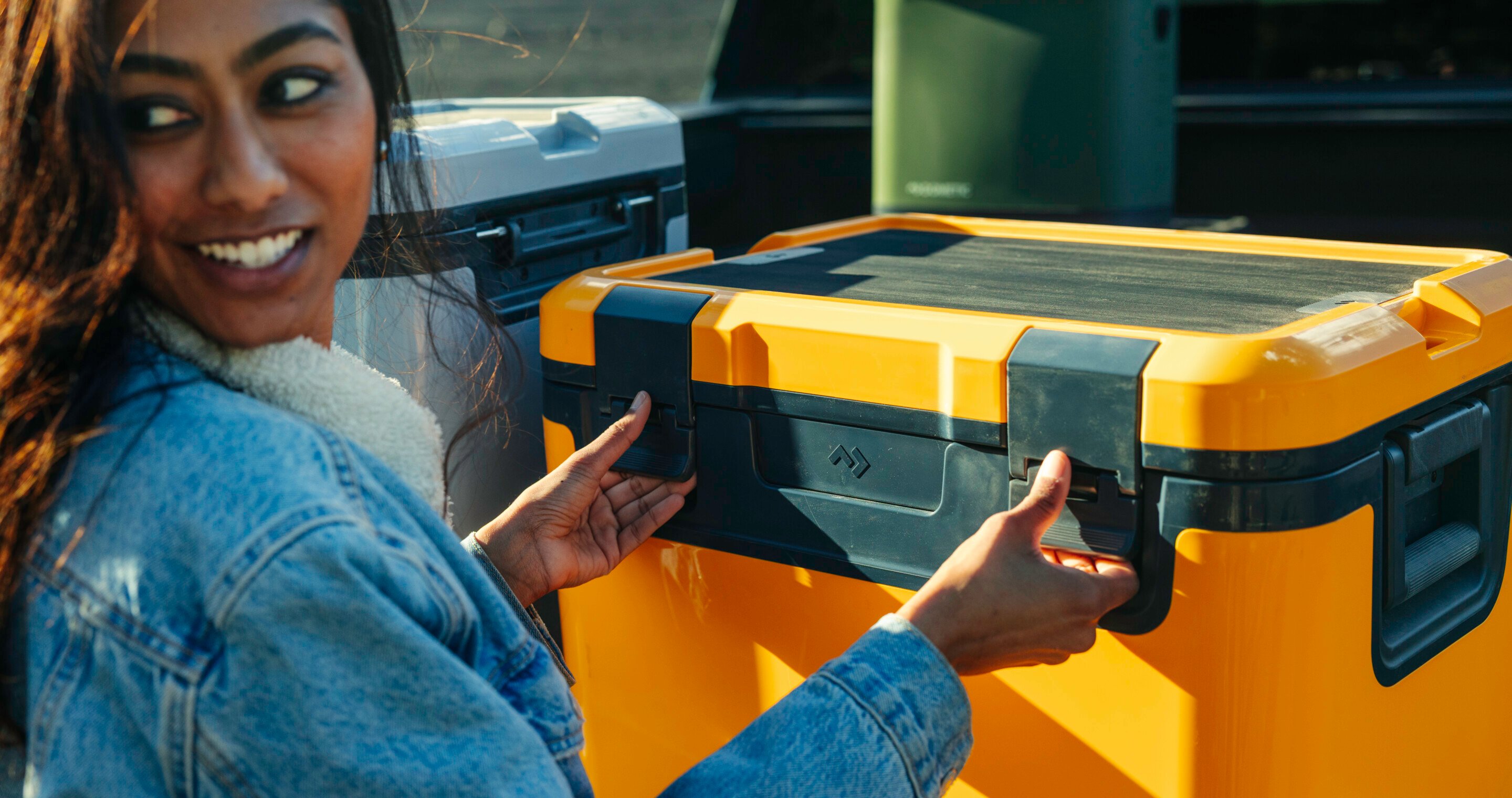 Woman opening cooler.