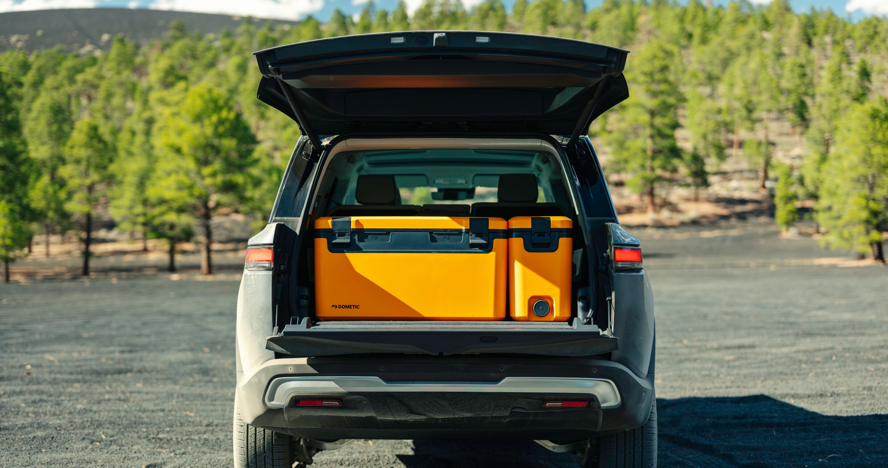 Back of car, packed with coolers.
