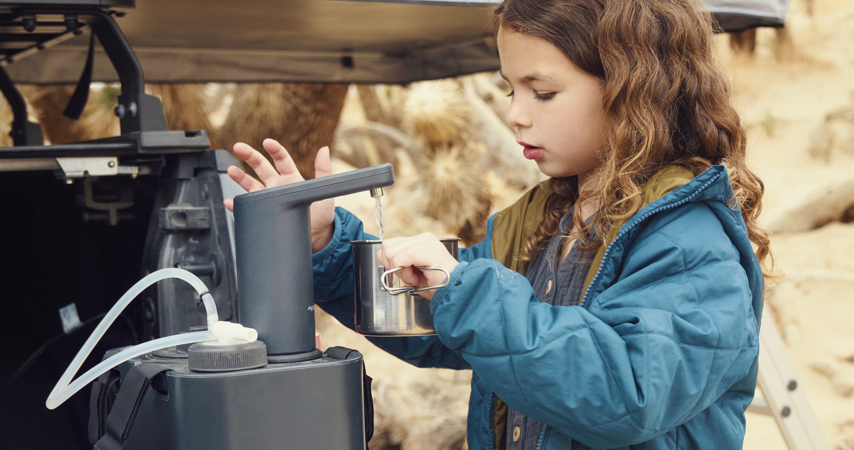 Girl using hyration faucet