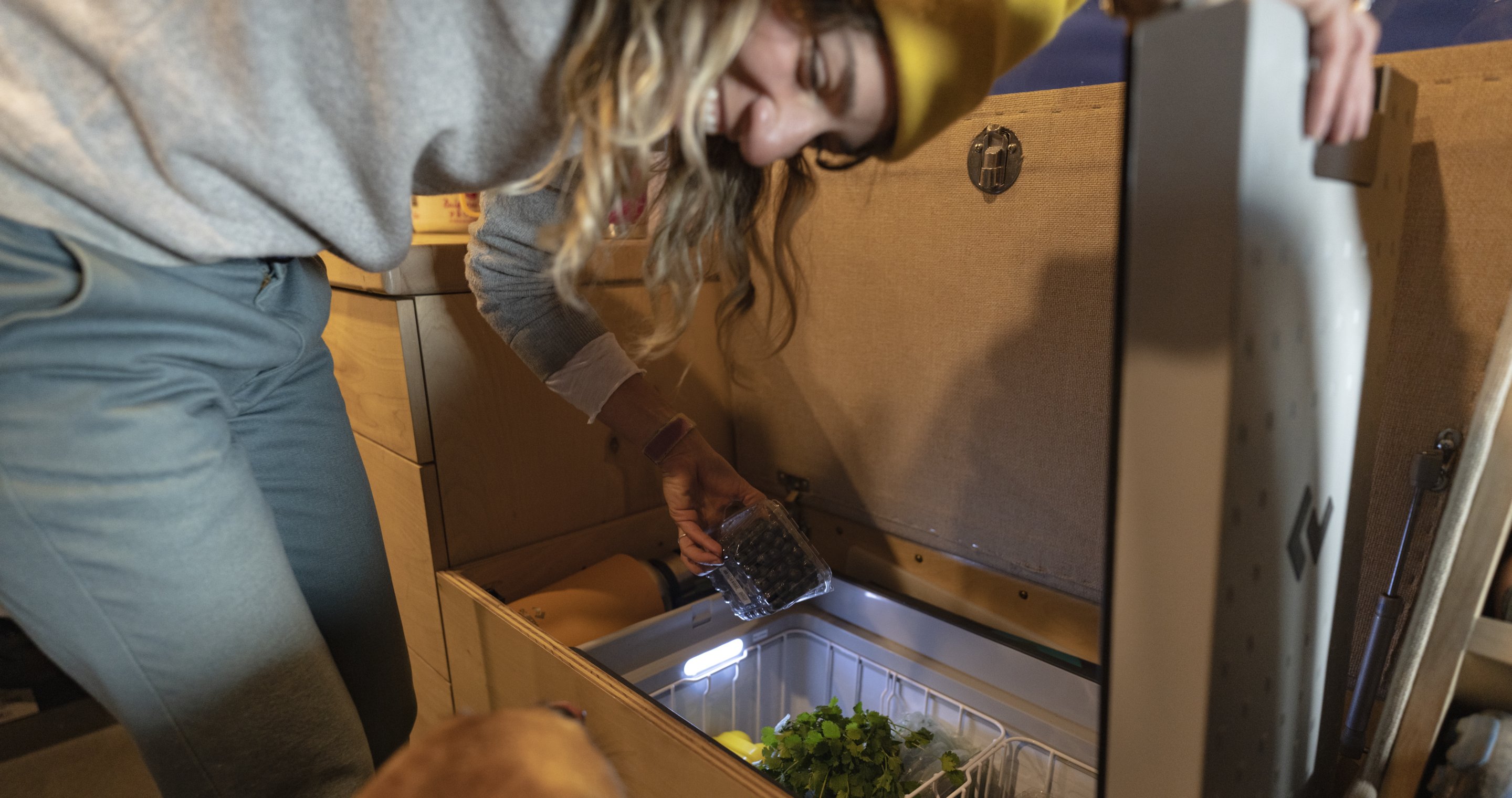 woman in cooler with fresh food