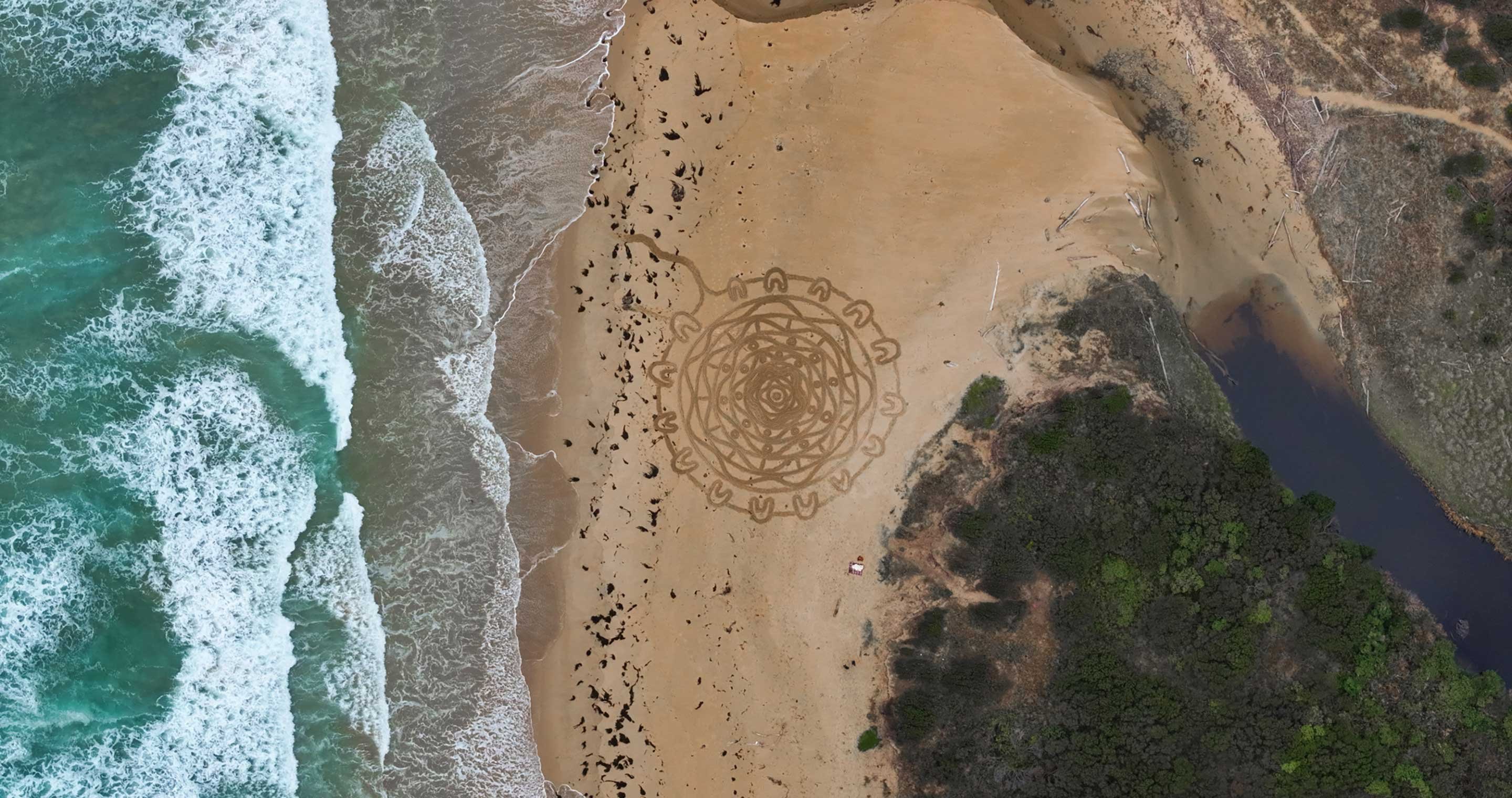 Lowell Hunters ceremony on beach seen from above