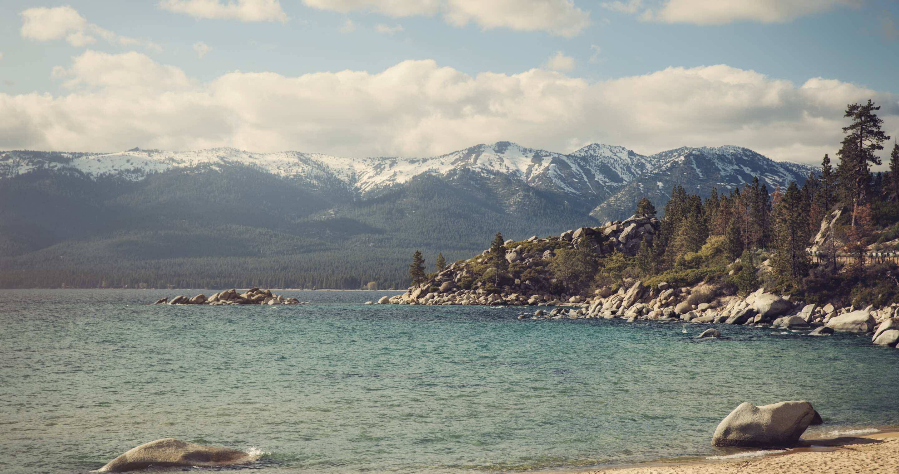 Pebble beach with mountains in the distance