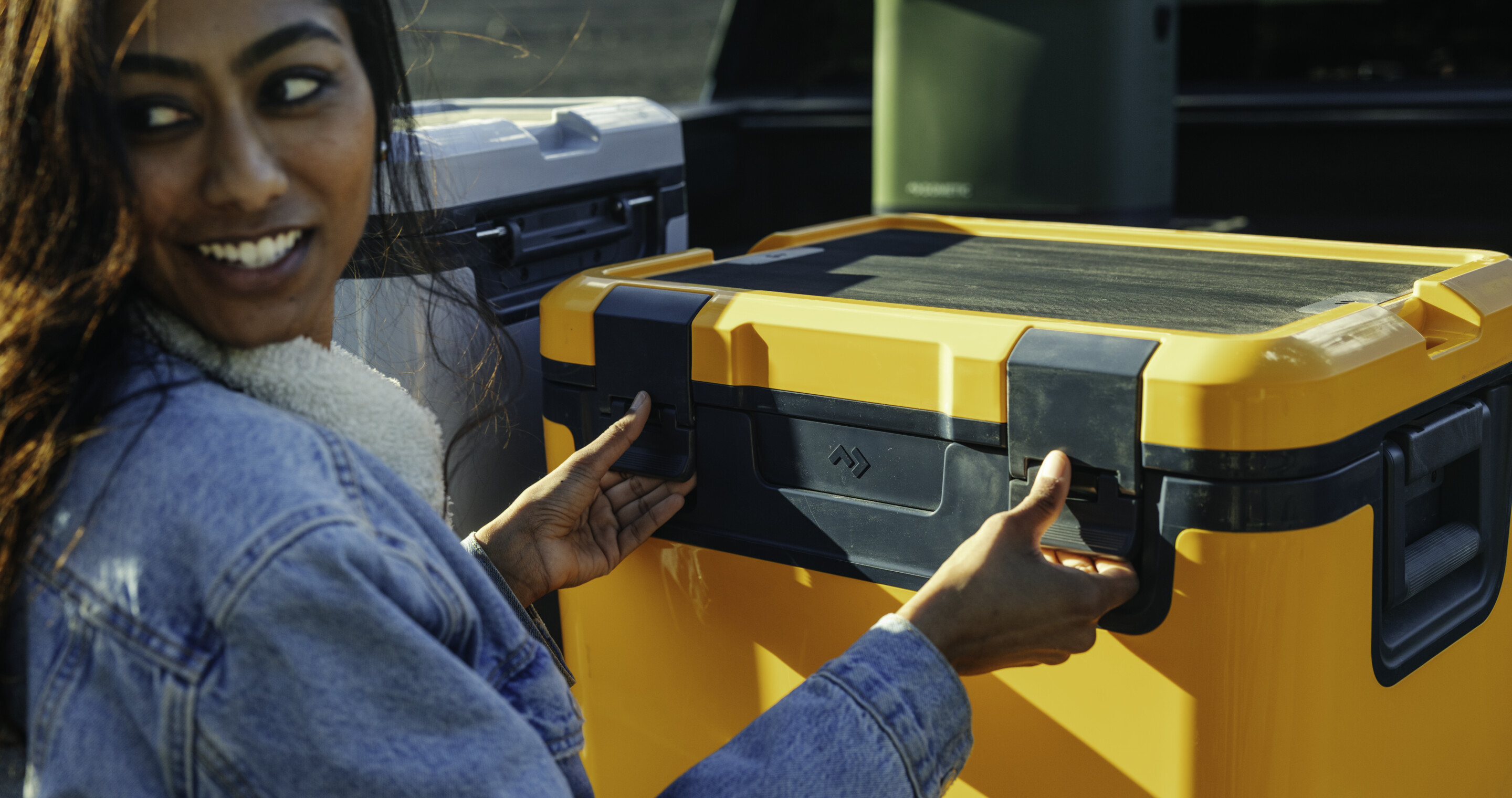 Woman opening cooler.