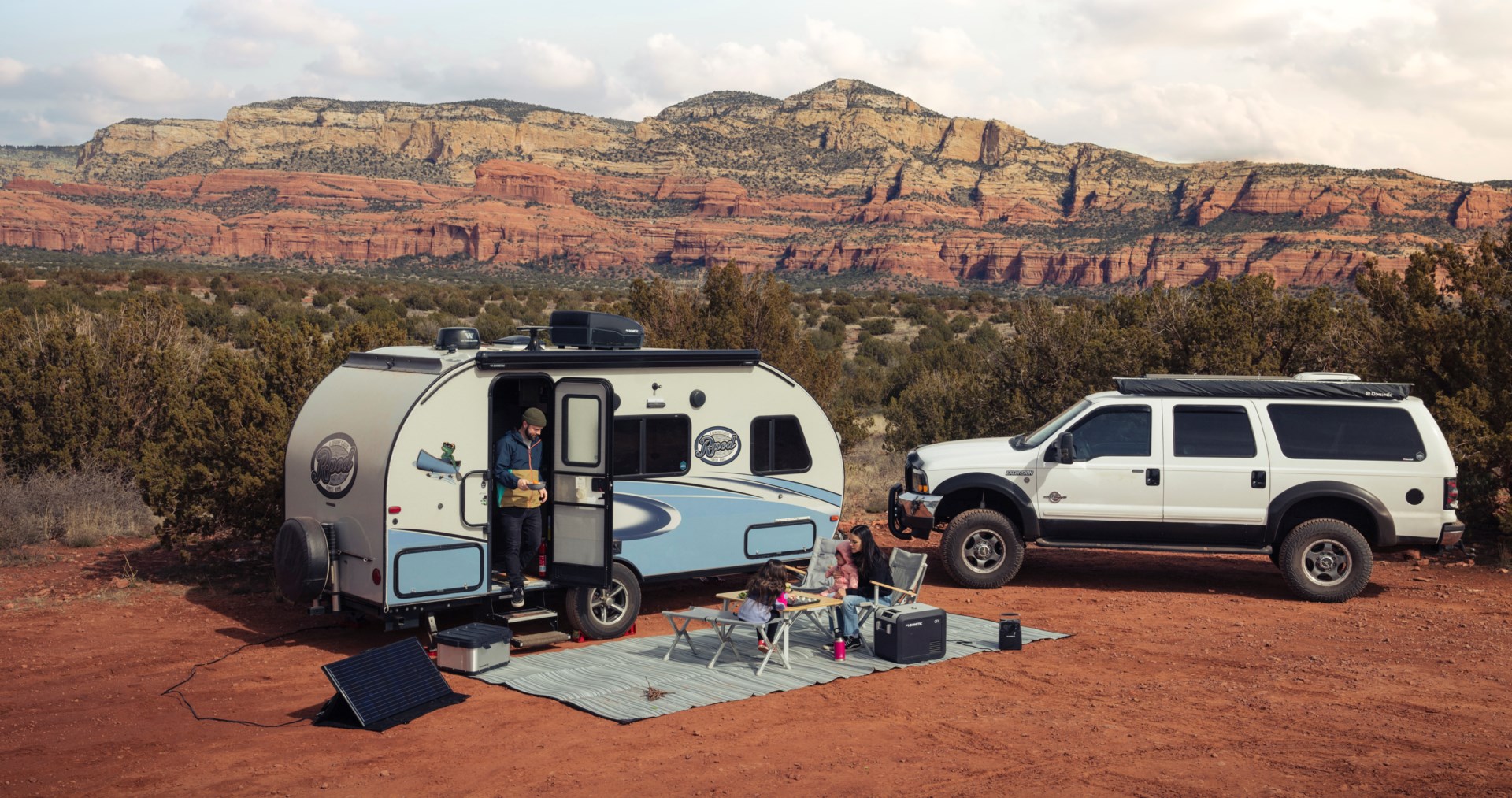 Tow behind RV and truck at campsite.