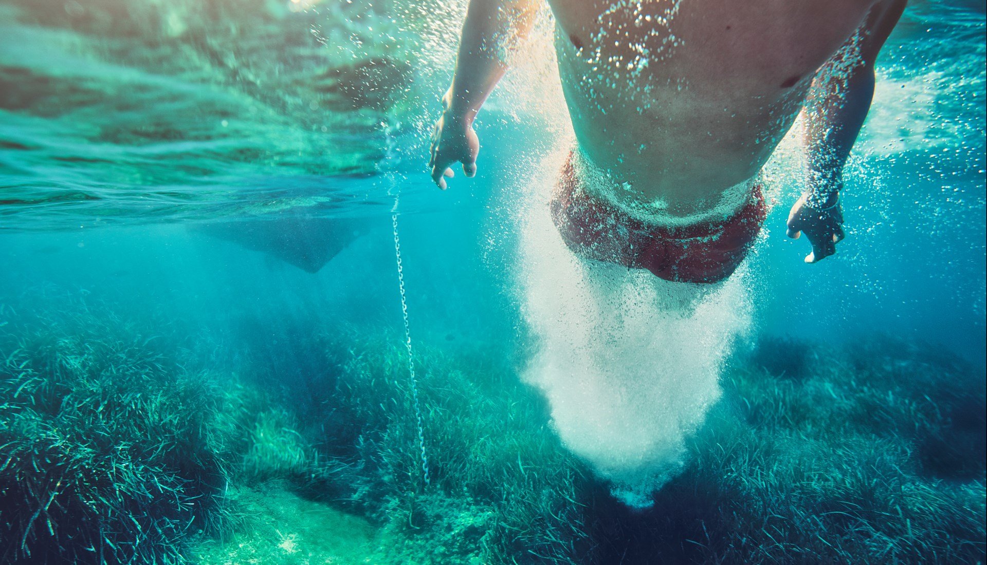 man swimming underwater