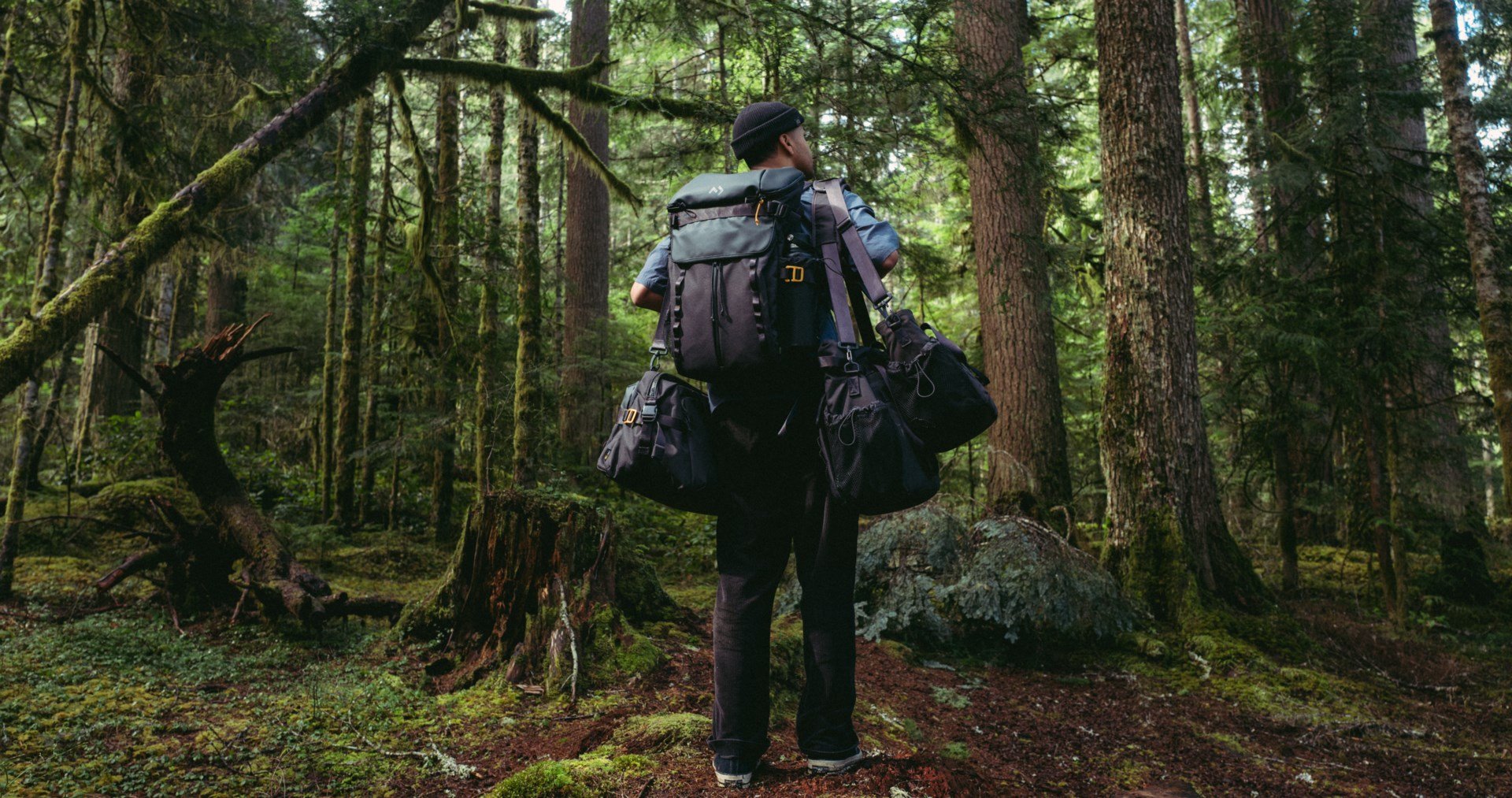 man with carrying bags in outdoors.